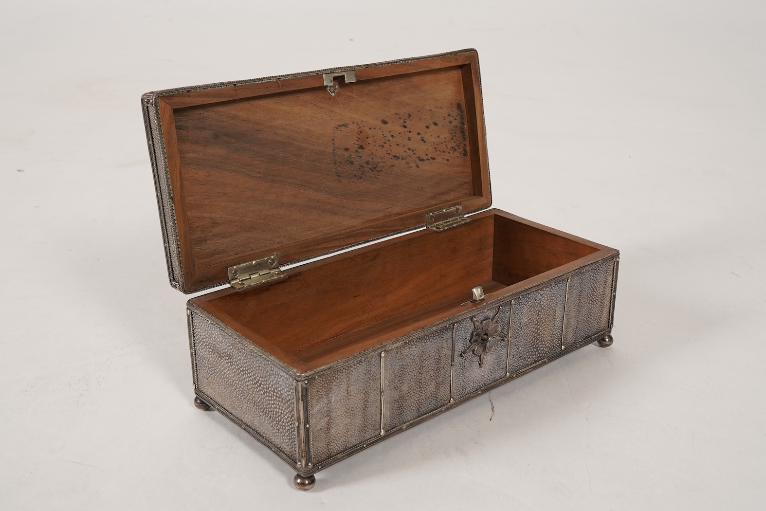 An early 20th century Arts & Crafts silver and shagreen mounted cigarette box with hinged cover, by John Paul Cooper